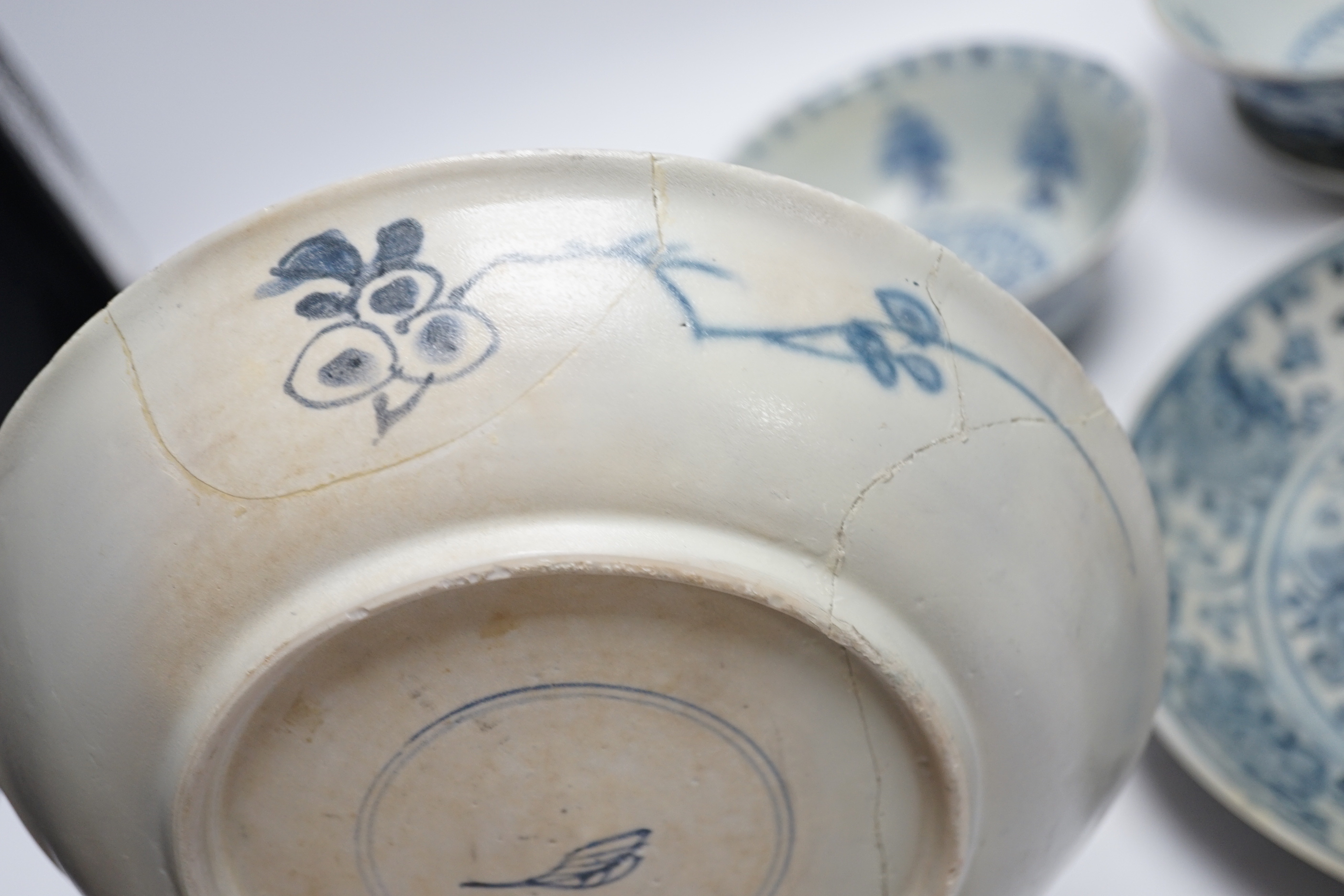 Chinese Ming dynasty shipwreck ceramics - three blue and white pottery bowls and three dishes, largest 25cm diameter